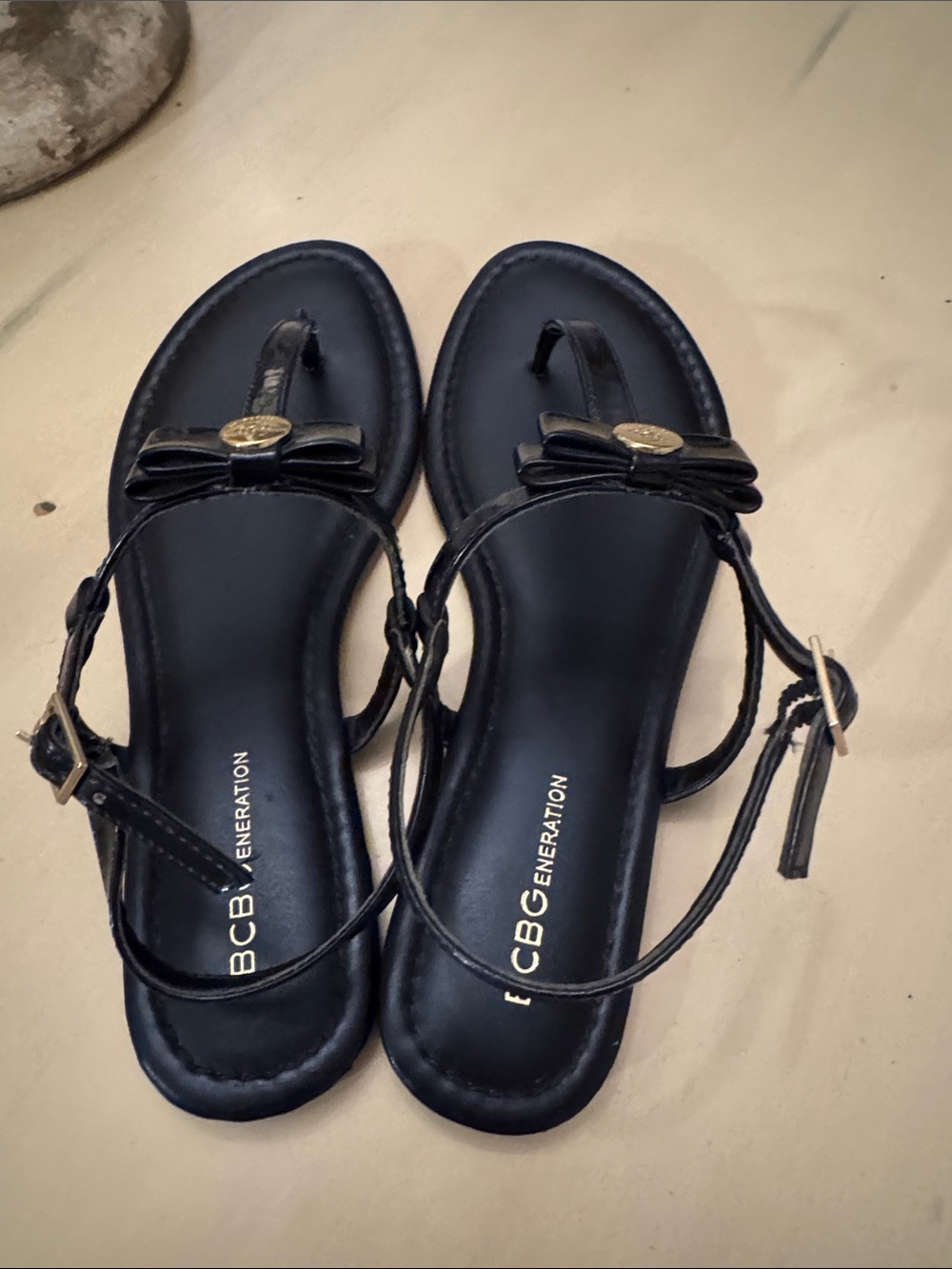 BCBGeneration Navy Blue Patent T-Strap Sandals with Gold Medallion - Picture 7 of 8